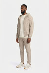 Tech Suit Beige mit Kapuze